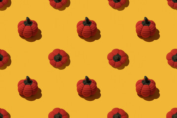 Seamless Halloween Knitted Pumpkin Pattern on Yellow Background