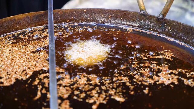 Slow motion shot of cooking of traditional Pakistani street food chappal kabab