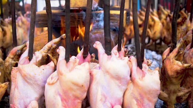 Slow motion shot of cooking of traditional Pakistani street food baloochi sajji