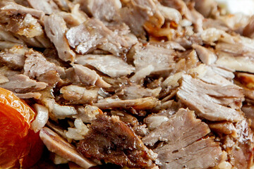 Shaved Grilled Meat Slices for Kebab or Gyro with Cooked Tomato