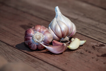 Garlic bulb and clove isolated. Garlic bulbs with cloves on wooden background