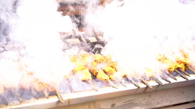 slow motion shot of Traditional bar b q of mutton at charsi tikka shop, Peshawar, Pakistan