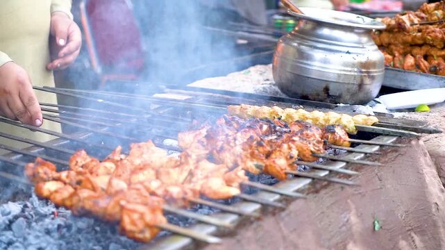 slow motion shot of Traditional bar b q of mutton at charsi tikka shop, Peshawar, Pakistan