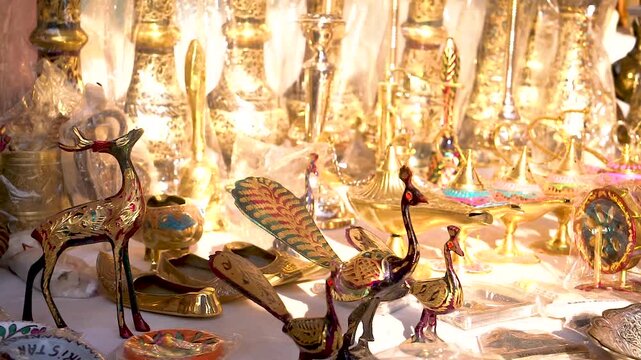 Slow-motion shot of Pakistani artist working on coppor