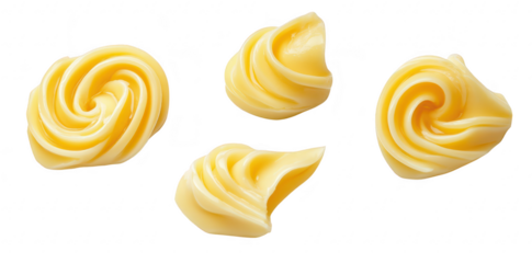 Swirls of creamy butter displayed on a clean white background. highlighting their smooth texture and inviting appearance. perfect for culinary use or food styling