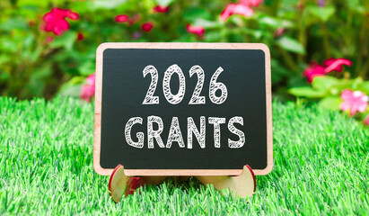 2026 GRANTS on chalk blackboard on green grass with natural background. Concept words 2026 GRANTS...
