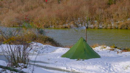 Winter season, camping in a tent with a stove © Gnye