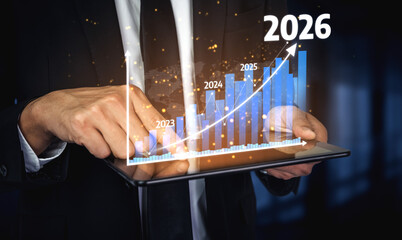 A business professional engaged in data analysis using a digital tablet display showcasing futuristic graphical trends and projections from 2023 to 2026. Tessel