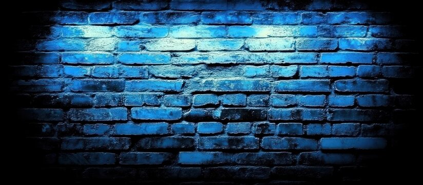 A striking dark blue brick wall illuminated by a bright light source