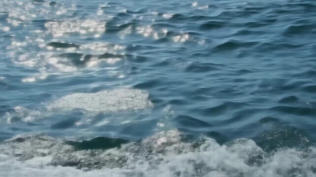 Sparkling Blue Ocean Water Surface with Sunlight Reflections