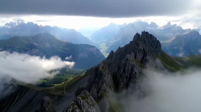 Majestic Panoramic View of Mountain Range with Dramatic Clouds and Valley