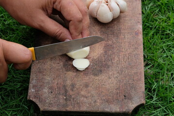 woman cutting the garlic