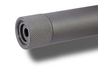 Shadow below the muzzle end of a rifle that is wearing a thread protector