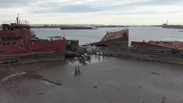 flying left view of decaying boats in Staten Island Boat Graveyard