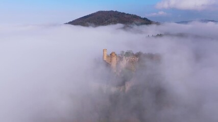 Aerial view of Auerbach Castle emerging majestically from a sea of fog, creating a surreal and ethereal landscape, Bensheim, Hessen, Germany. - Powered by Adobe