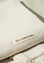 100% compostable fabric with label and natural fibers close-up  