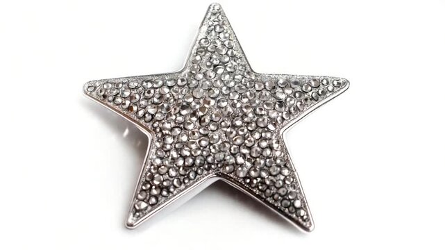 A silver star-shaped brooch adorned with many crystals