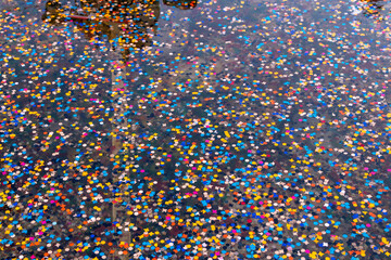 Colorful Confetti Floating on Water