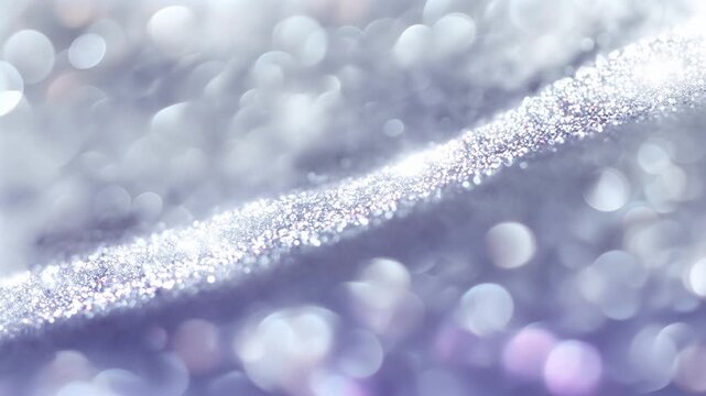 Close up of shimmering glitter and bokeh lights in silver and lavender hues, creating an abstract dreamy background texture ideal for luxury branding and festive visuals.