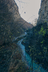Mighty cliffs and turquoise river: mountain landscape
