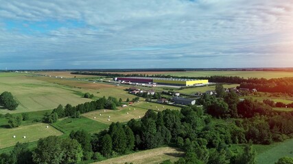 Modern warehouse exterior with trailers and loading bays