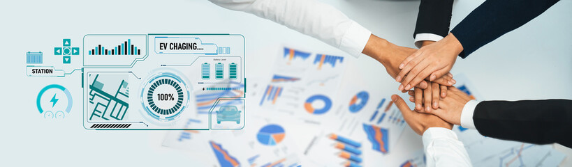 A dynamic scene showcasing collaboration in business focused on electric vehicle charging station...
