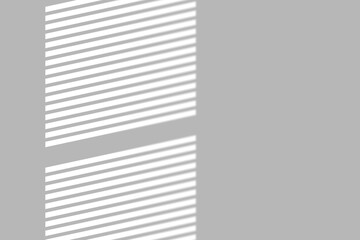 Sunlight streaks across a clean gray wall, creating a modern, minimalist backdrop for your design projects.