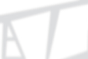 Soft geometric shadow patterns cast on clean white background creating modern minimalist ambiance