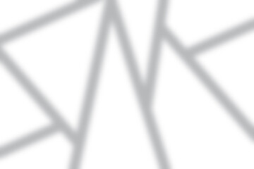Abstract shadow pattern overlaying a bright white background for modern design aesthetics