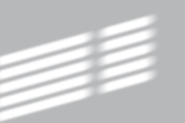 Minimalist sunlit window shadow on gray wall creating a sense of calm and serenity for design needs