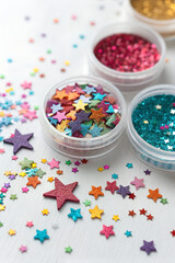 Close-up of colorful nail glitter sequins from above