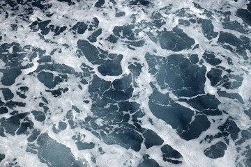 The beach foam in the sea is pure like silk