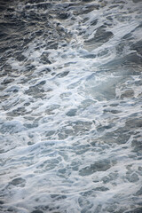 The beach foam in the sea is pure like silk