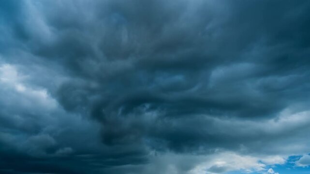 Dramatic dark storm clouds gathering in the sky with rain
