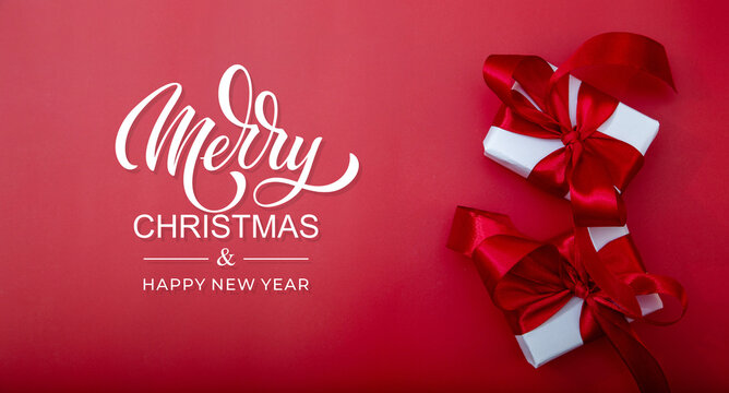 Merry Christmas and Happy New Year greeting card, frame, and banner. Holidays design. Noel and Feliz Navidad. Christmas gifts and decorations, top view. Flat lay. - Powered by Adobe