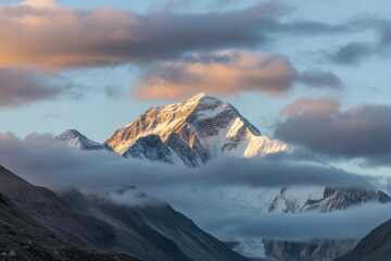 Mount everest peak covered in clouds during sunrise in himalayas, nepal