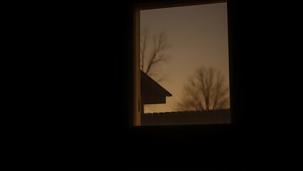 temporary. Temporary light glowing in an empty house window during dusk. real-estate listings, architecture portfolios, designed for real-estate listing and luxury residence showcases.