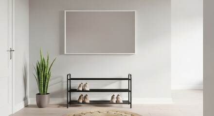 Entryway with shoe rack, plant, and framed art against a neutral wall