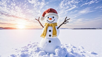 Obraz premium Joyful snowman wearing santa hat and scarf in winter sunset
