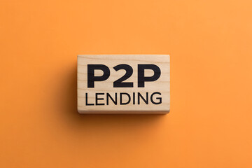 P2P Lending Concept on Wooden Block – Peer to Peer Financial Service

