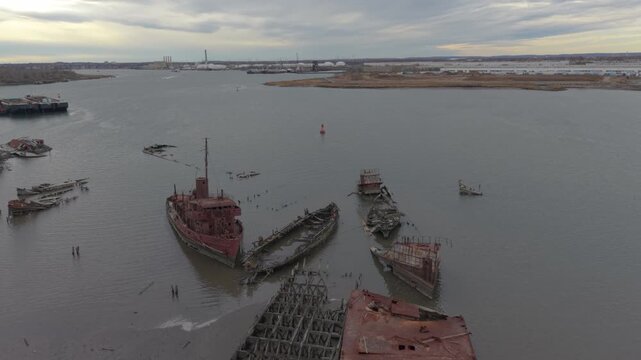 flying counter clockwise aerial shot of Staten Island Boat Graveyard