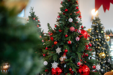 Merry x-mas,Close up of Colorful balls ,gifts box and Christmas greeting picture parcel,bell decoration on Green Christmas tree background Decoration During Christmas and New Year.