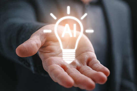 AI glowing light bulb in hand representing innovation and intelligent technology.