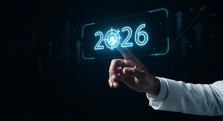 Finger touching a glowing 2026 target button with growth graph background.