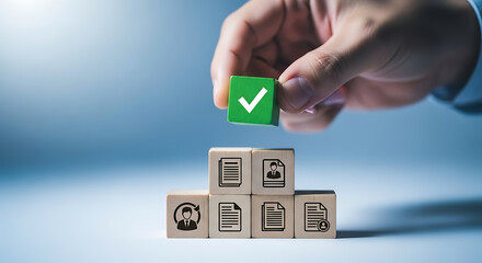 Hand placing a green wooden block with a checkmark on top of other blocks with document and profile icons representing approval process.