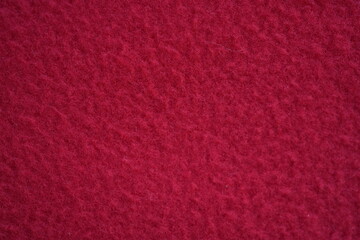 Fototapeta premium red fleece fabric texture, macro texture fleece orange fabric photo above as background 