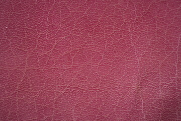 pink leather texture close-up, seams on leather jacket as background, light pink natural leather as background, black leather stitching	
