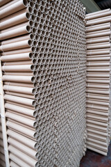 Stack of cylindrical cardboard tubes.