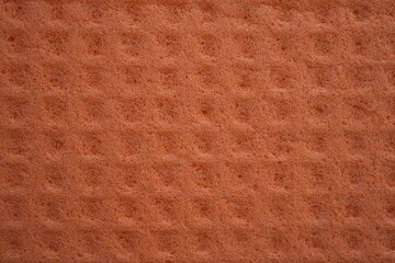 orange sponge texture close up, pink abstract sponge texture as background photo on top	
