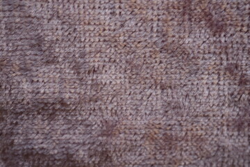Dusty rose velour fabric texture, close-up  macro view of dusty rose velour fabric showing its soft, plush surface and fine fibers. The detailed texture highlights the smooth, slightly fuzzy appearanc